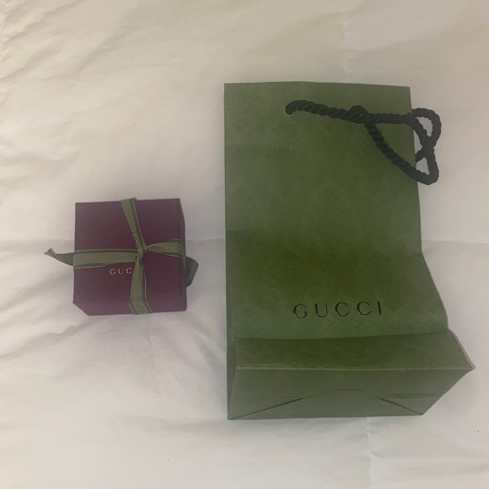 Empty Gucci jewelry box and shopping bag